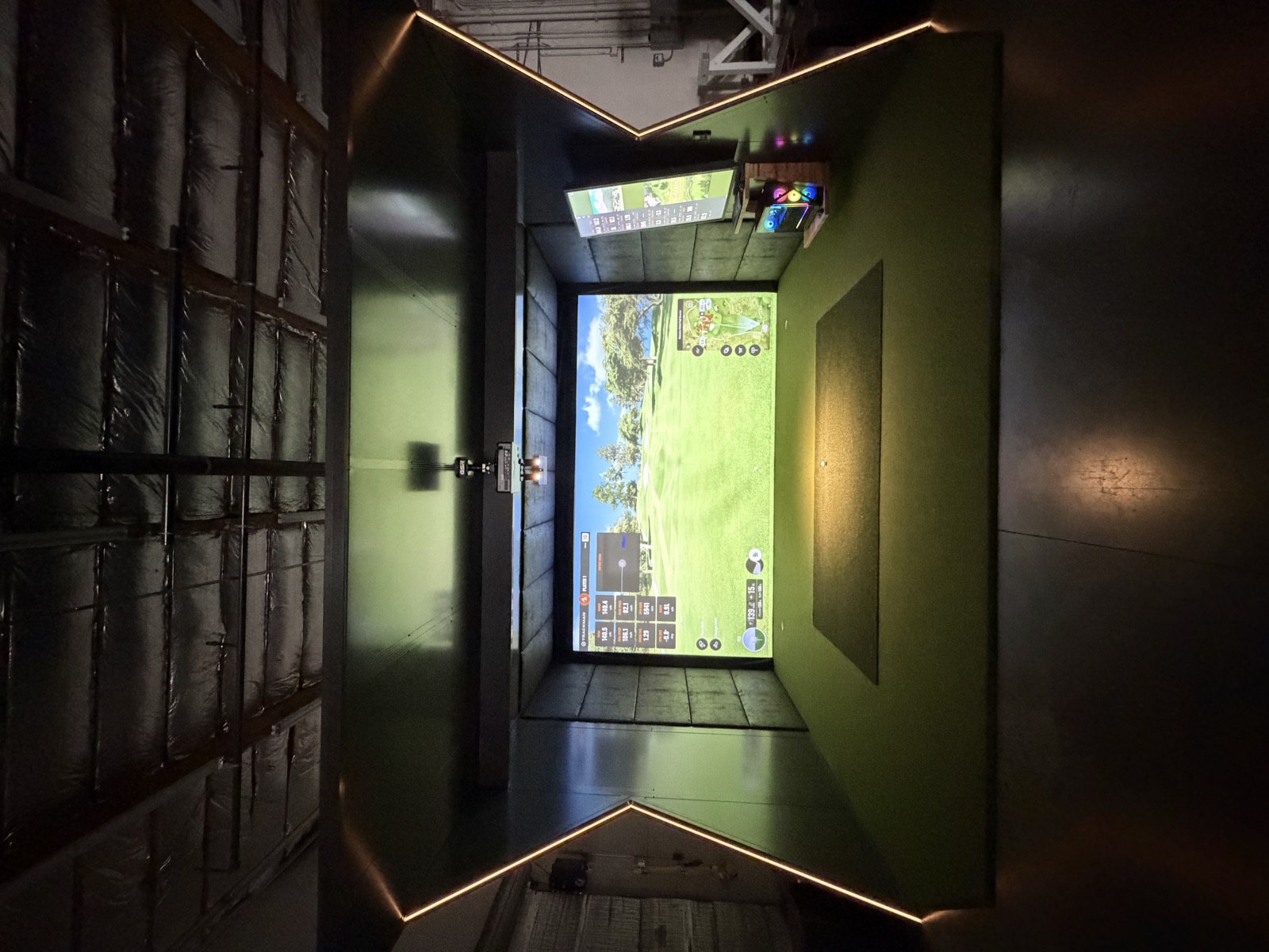 Nate's GSR sim room head-on, course on screen and LED-lit frame glowing
