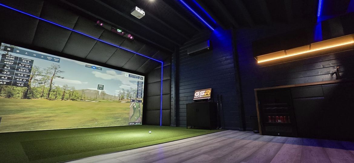 inside a golf sim log cabin